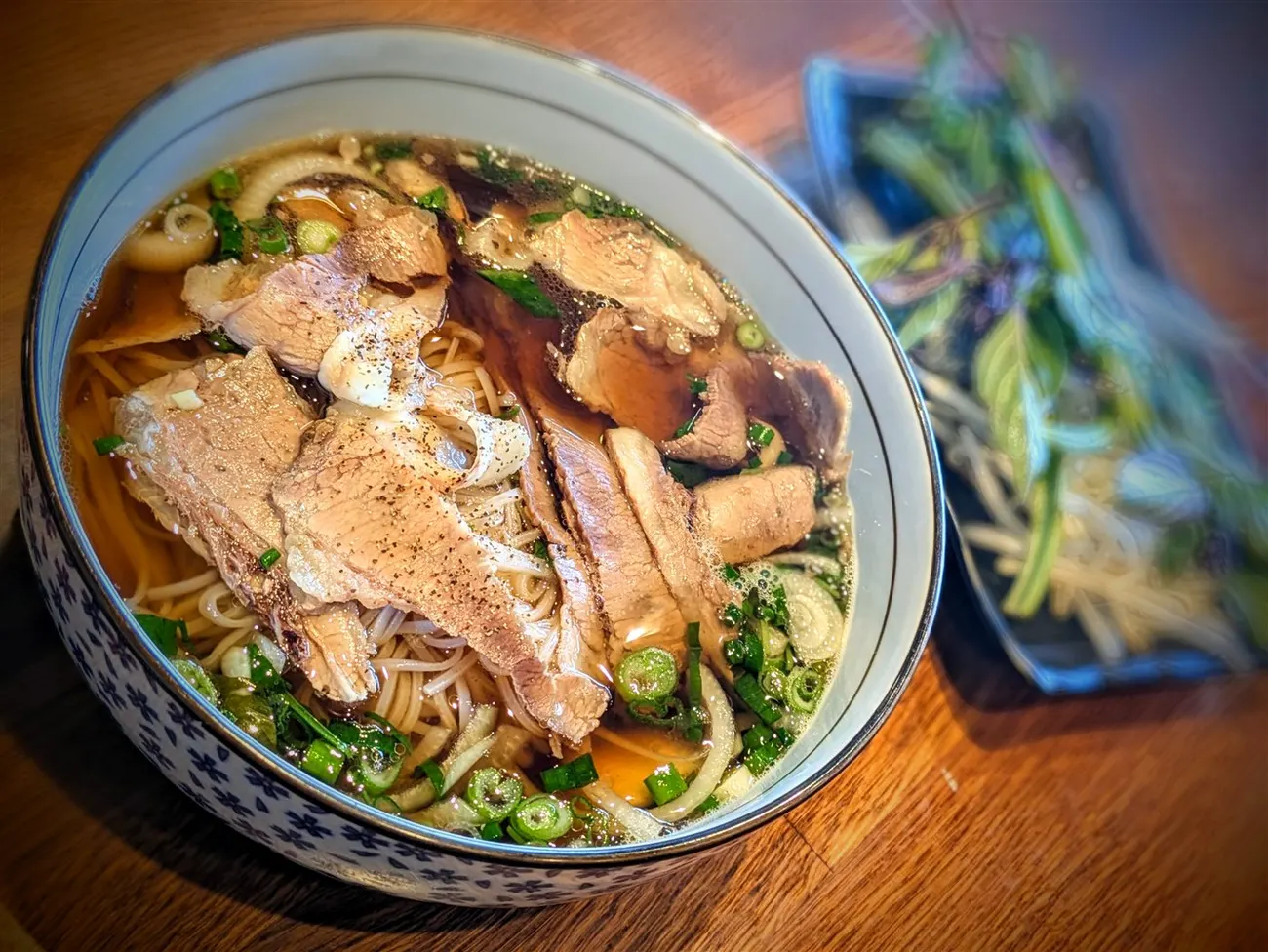 Bowl of The Spark Phở with one protein in classic beef broth at Fire Pho in Huntington Beach, CA.